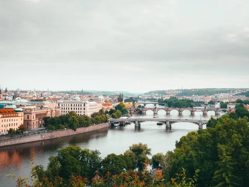 A stunning aerial view of Prague highlighting the city's bridges and historical architecture.