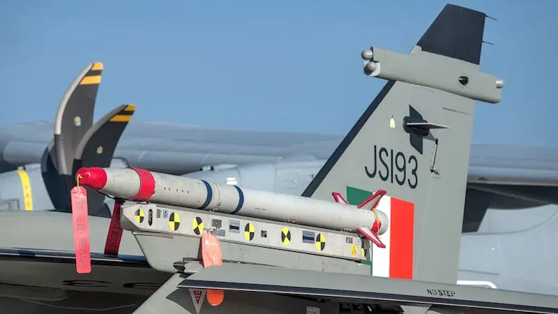Aircraft tail with missile at Aero India in Bengaluru. Detailed close-up for aviation enthusiasts.
