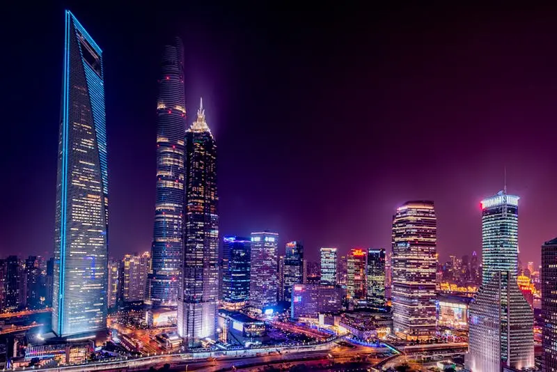 Majestic view of Shanghai's illuminated skyline featuring iconic skyscrapers at night.