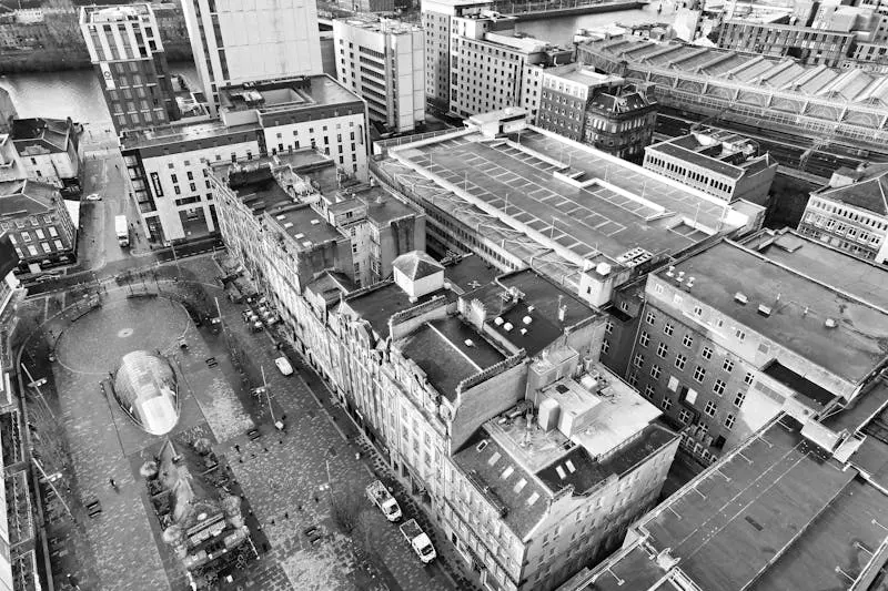 A dramatic aerial view of Glasgow city center showcasing urban architecture and streets.