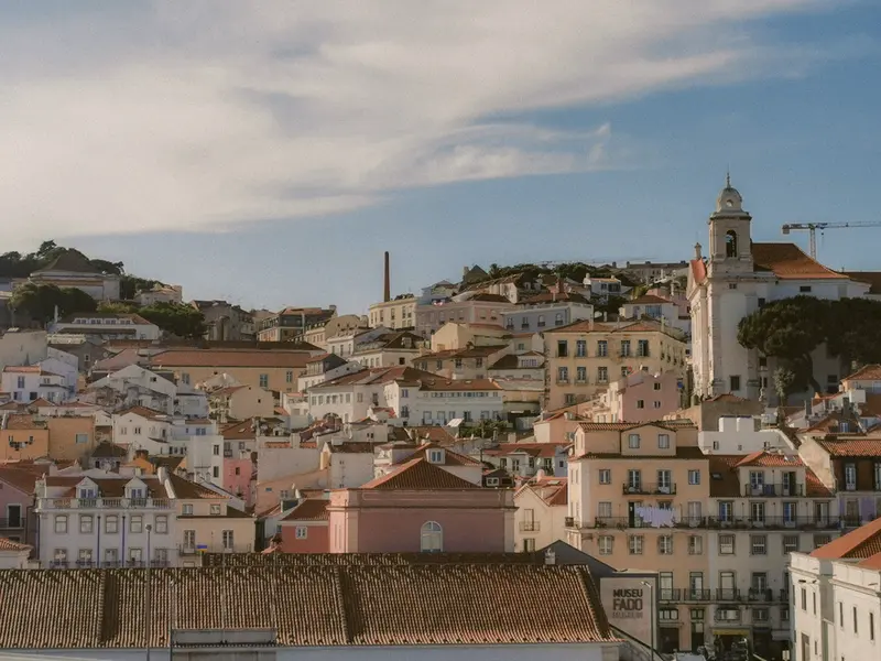 Aerial view of Lisbon's charming historic architecture under a bright sky.